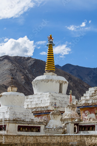 White buddhist stupa or pagoda in tibetan monastery near village Leh in ladakh, noth India