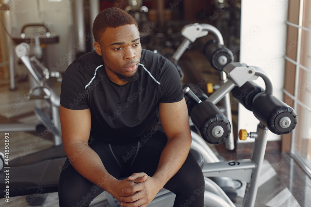 A handsome black man is engaged in a gym A handsome black man is engaged in a gym