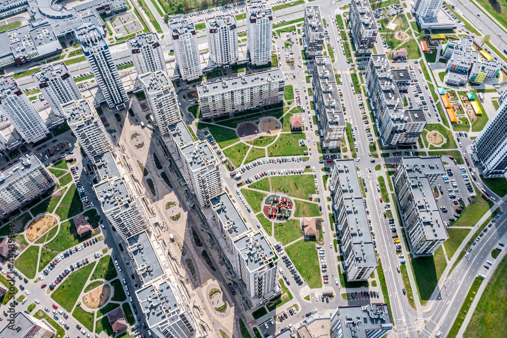 Fototapeta premium new high-rise apartment buildings in modern residential neighborhood. aerial view on summer day