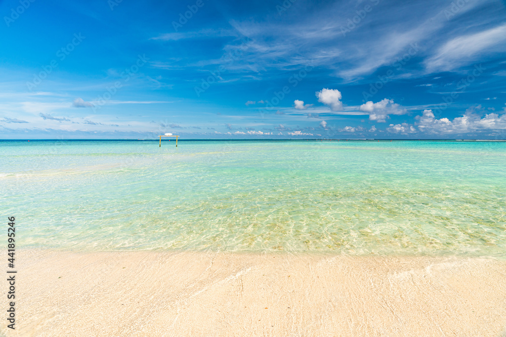 Fototapeta premium Paradise white sand beach and turquoise water in nice summer day, Gulhi Island, Maldives