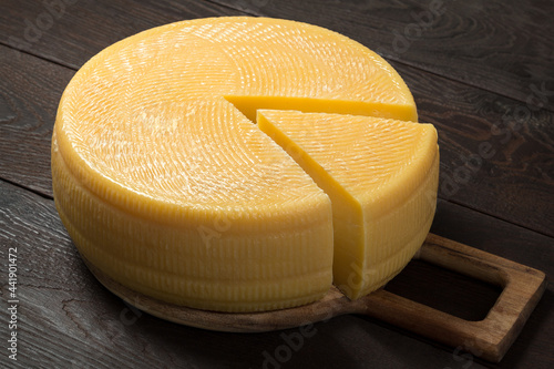 Canestrato cheese on a wooden board