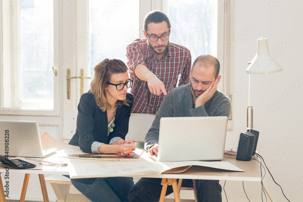 Three colleagues working from home on a project. Three colleagues working from home on a project.
