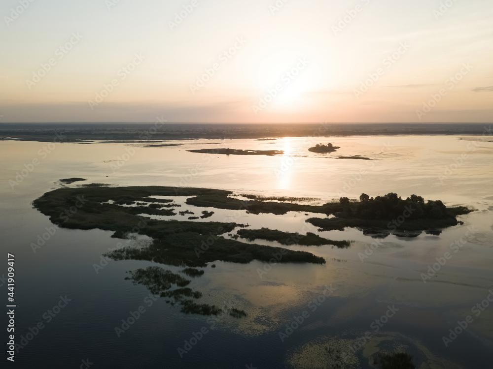 Sunrise over the wide river Dnieper. Aerial drone view. Sunrise over the wide river Dnieper. Aerial drone view.