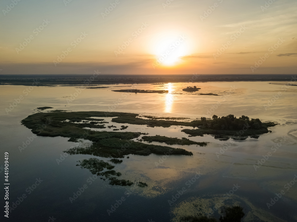 Fototapeta premium Sunrise over the wide river Dnieper. Aerial drone view.