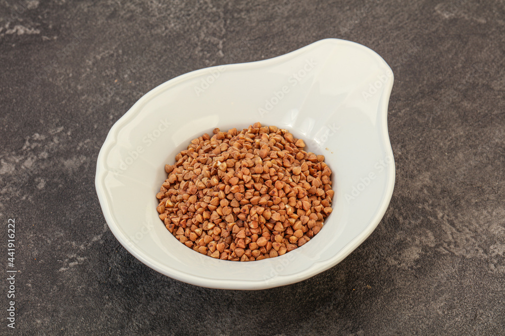 Raw buсkwheat cereal in the bowl Raw buсkwheat cereal in the bowl