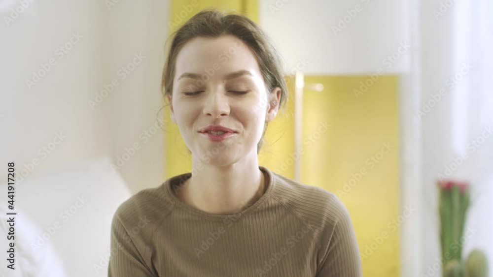 An attractive lady is looking to the camera and talking An attractive lady is looking to the camera and talking