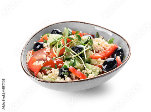 Bowl with couscous and vegetables on white background