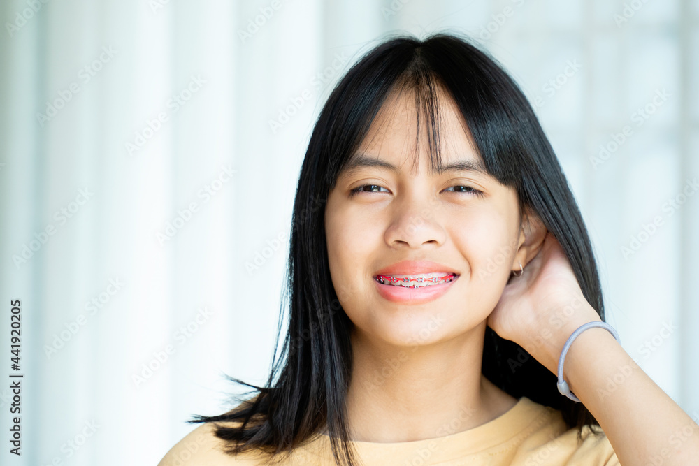 Dental Brace Girl Smiling and Looking to Camera, She Feel Happy and Have Good Attitude with Dentist. Motivate Kids not Fear When they have to go to Dental Clinic. Dental Brace Girl Smiling and Looking to Camera, She Feel Happy and Have Good Attitude with Dentist. Motivate Kids not Fear When they have to go to Dental Clinic.