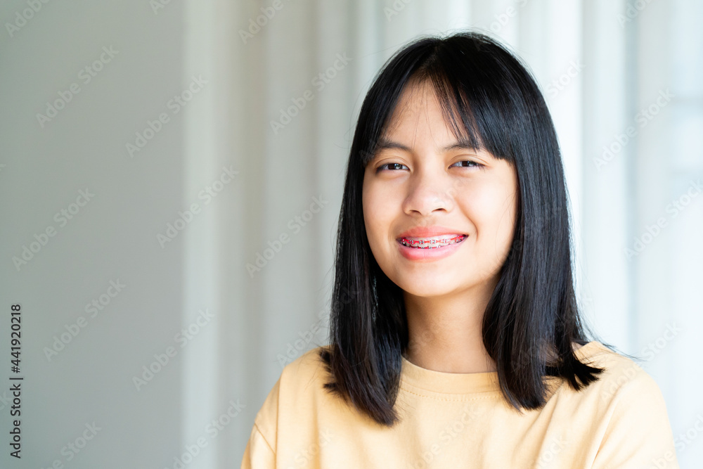 Dental Brace Girl Smiling and Looking to Camera, She Feel Happy and Have Good Attitude with Dentist. Motivate Kids not Fear When they have to go to Dental Clinic. Dental Brace Girl Smiling and Looking to Camera, She Feel Happy and Have Good Attitude with Dentist. Motivate Kids not Fear When they have to go to Dental Clinic.