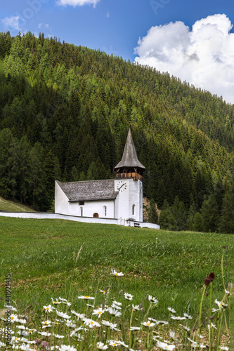 Church of the dear Lady, Frauenkirch on the green hill, in Davos district, Grisons, Switzerland photo