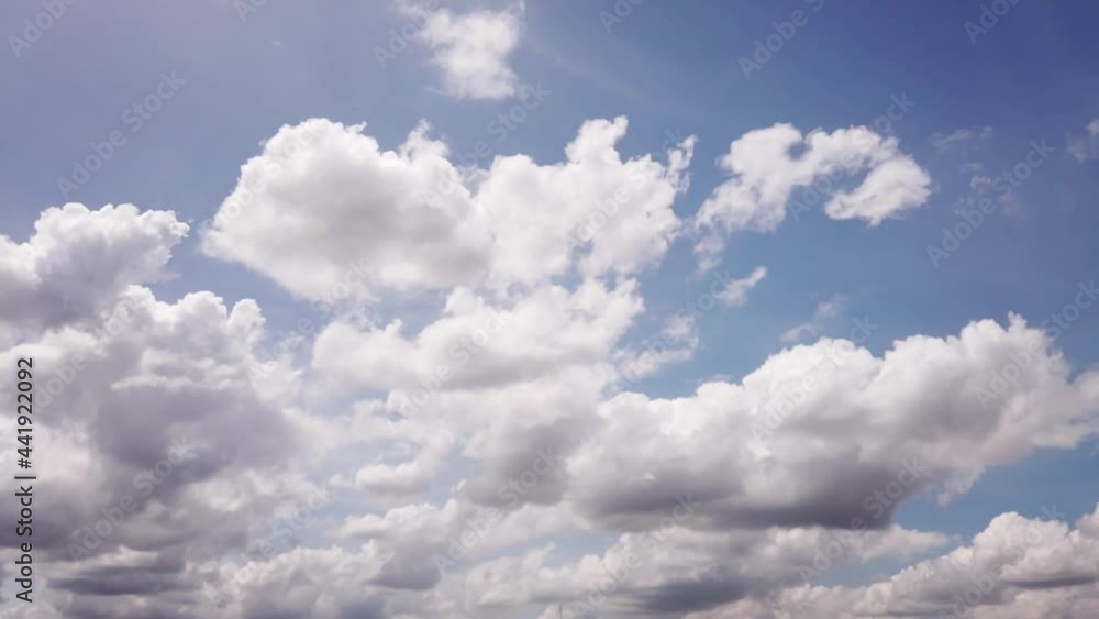 Puffy fluffy white clouds. Cumulus cloud cloudscape timelapse. Blue sky time lapse. Nature weather blue sky. White clouds background. Puffy fluffy white clouds. Cumulus cloud cloudscape timelapse. Blue sky time lapse. Nature weather blue sky. White clouds background.