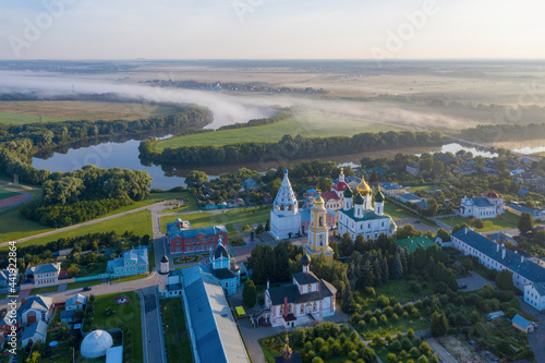 Aerial view of the town, Novo-Golutvin monastery and Moscow river covered with mist. Kolomna, Moscow Oblast, Russia.