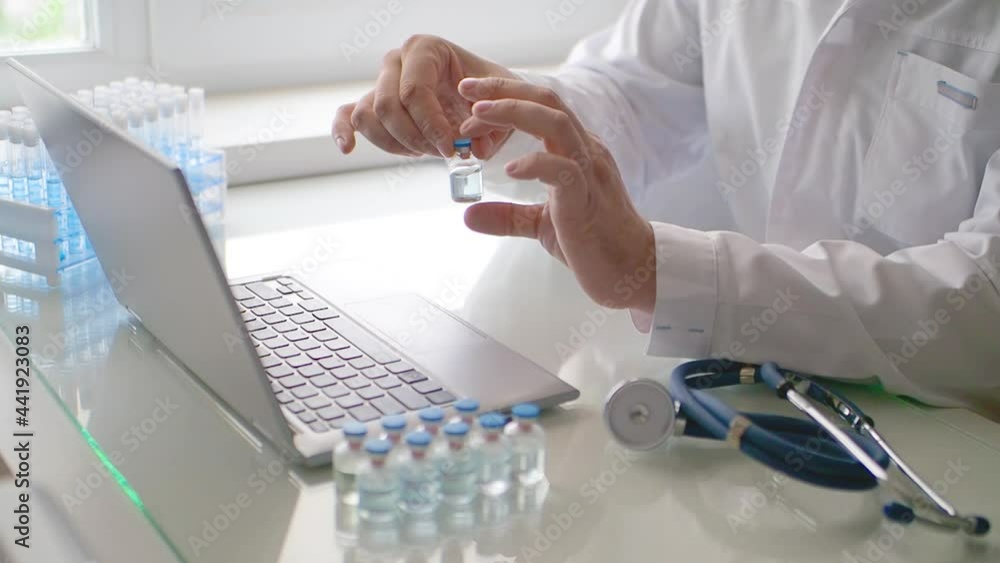 Doctor talks about the newest vaccine during an online video call. He talks about all the advantages of the new medicine. Doctor talks about the newest vaccine during an online video call. He talks about all the advantages of the new medicine.