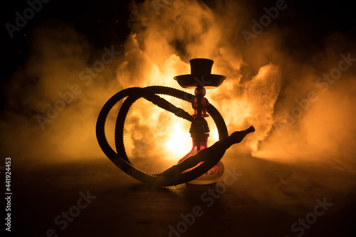 Hookah hot coals on shisha bowl with black background. Stylish oriental shisha. Shisha Concept © zef art