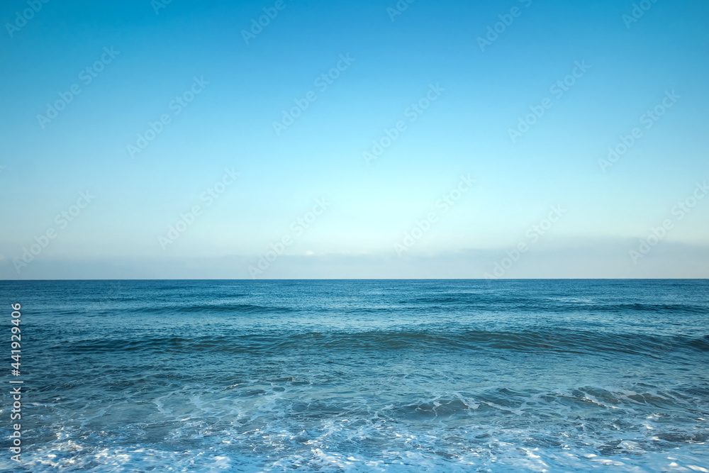 View of the ocean or sea in blue in the morning. Relaxation, calmness concept. Copy space. View of the ocean or sea in blue in the morning. Relaxation, calmness concept. Copy space.