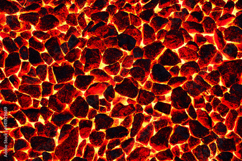 Smoldering charcoal in a burning stove. The texture and pattern of a natural mineral. Red fire background.