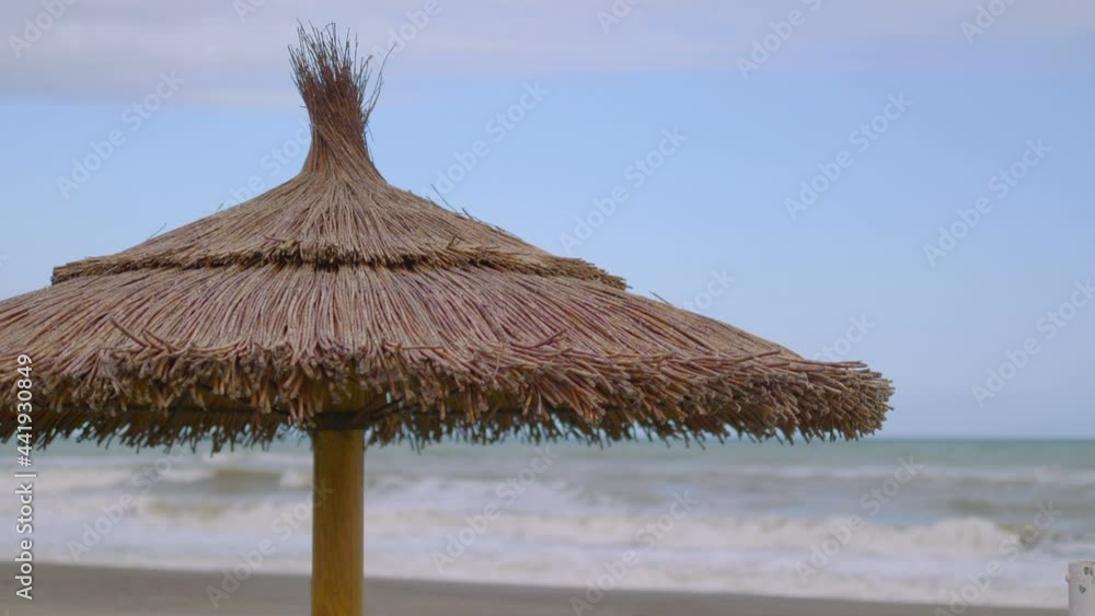 Umbrella on the beach in 4k slow motion 60fps Umbrella on the beach in 4k slow motion 60fps