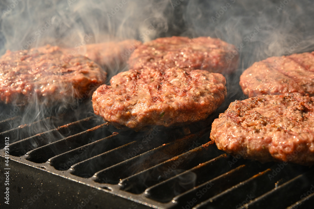 Beef burger for hamburger on barbecue grill Beef burger for hamburger on barbecue grill