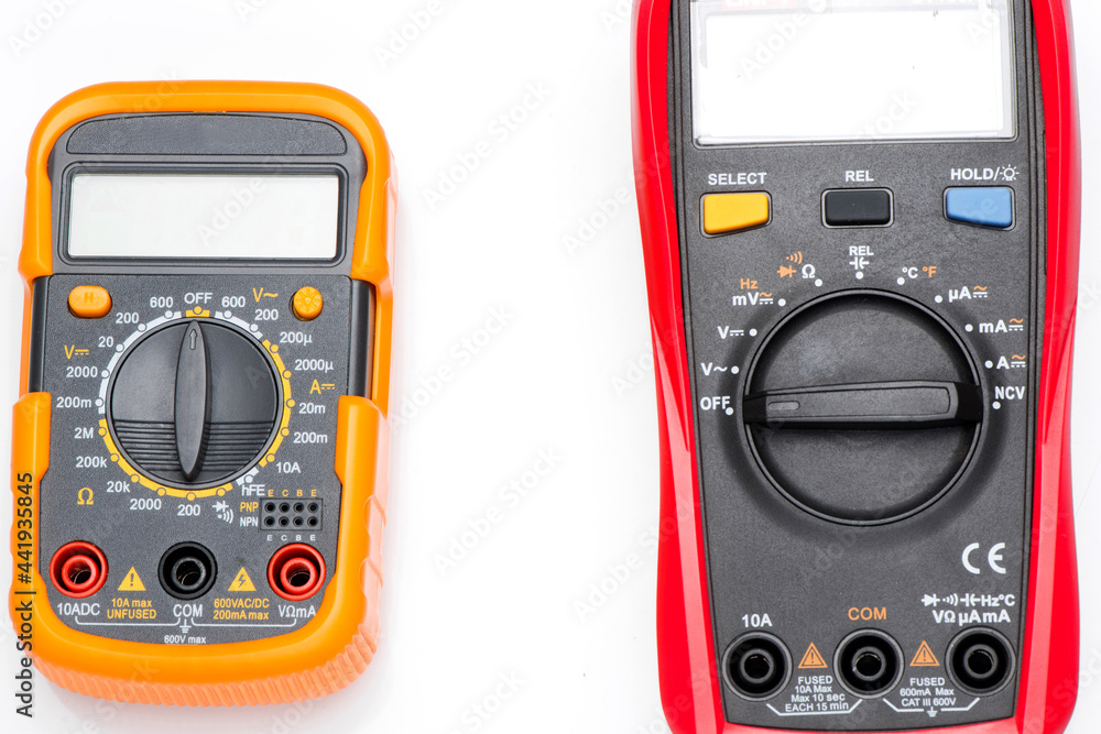 Electronic digital multimeter isolated on white with probes. Digital