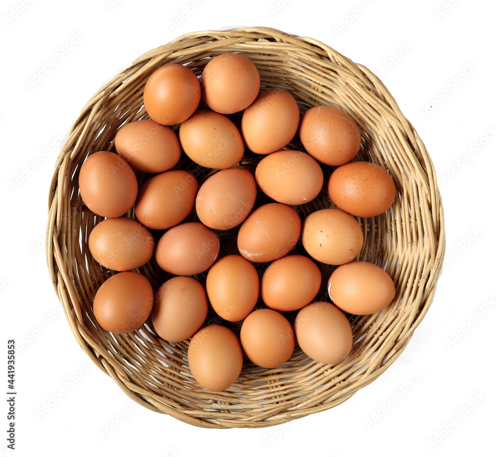 Fresh eggs in the basket isolated on white background Fresh eggs in the basket isolated on white background