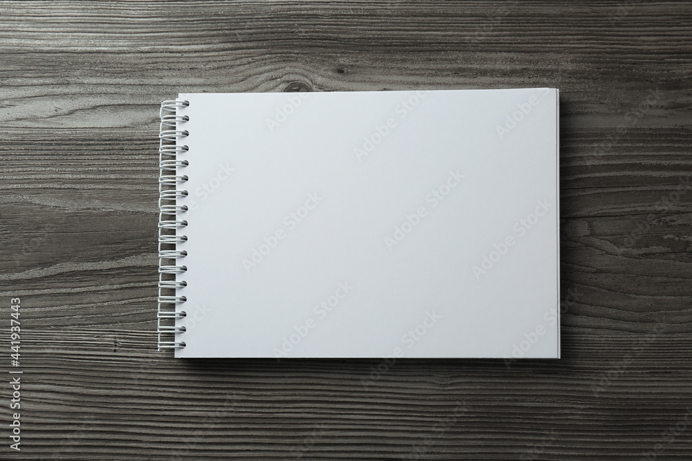 Blank paper brochure on wooden table, top view. Mockup for design Blank paper brochure on wooden table, top view. Mockup for design