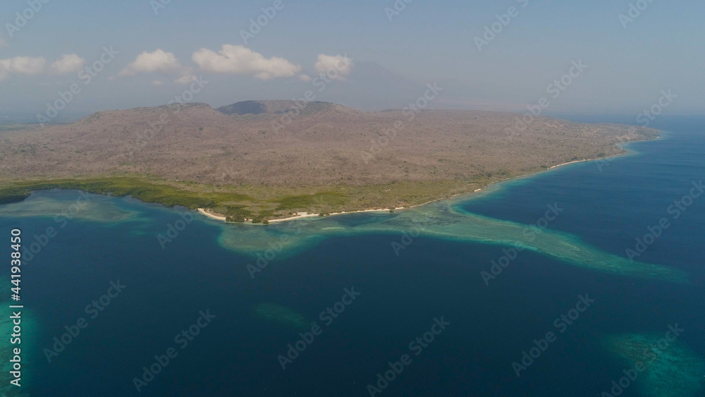 aerial view coastline with beach and coral reef coral reef. seascape atoll with bay turquoise water in sea.Tropical coral reef in ocean waters. Travel concept.