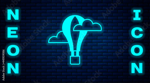 Glowing neon Hot air balloon icon isolated on brick wall background. Air transport for travel. Vector