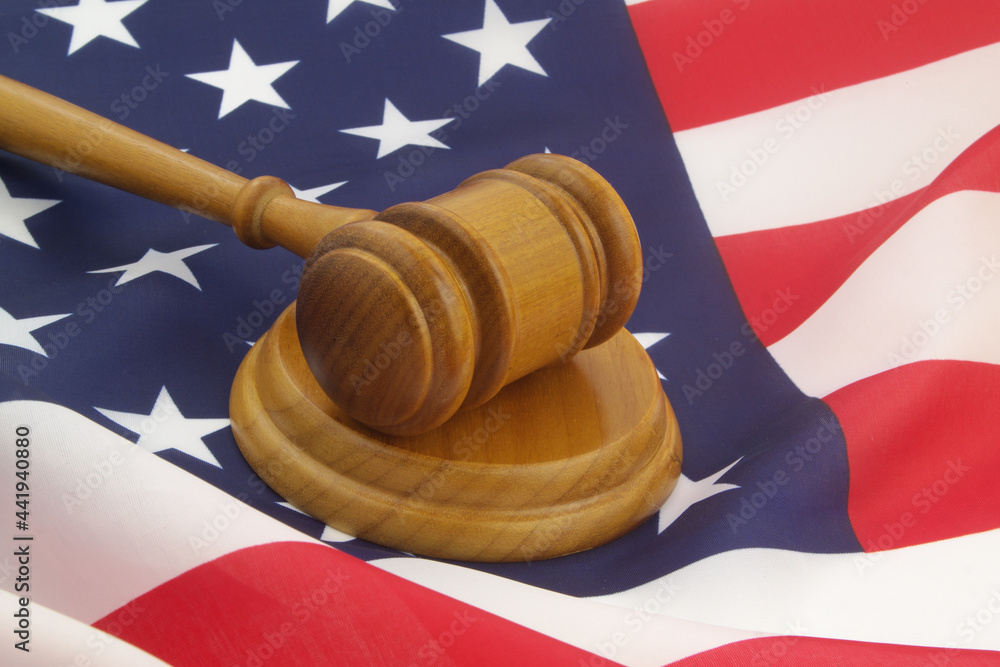 Judge gavel on US flag. Court and legal system of USA concept.