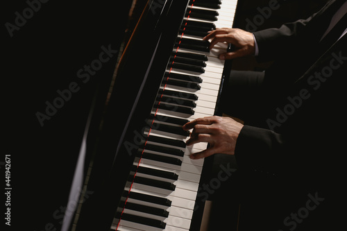 Photography Man playing piano, above view. Talented musician