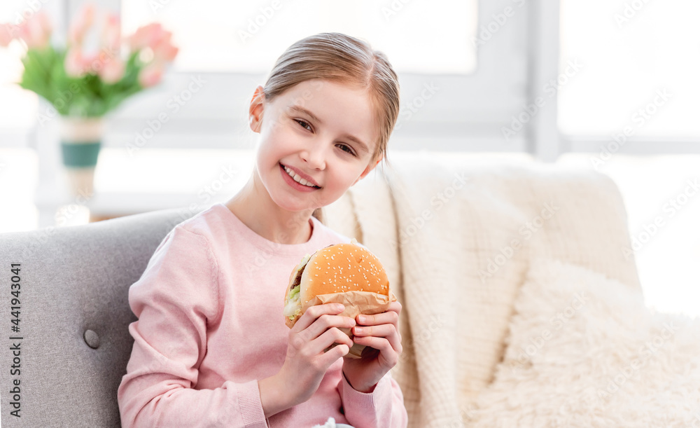 Little girl with hamburger Little girl with hamburger