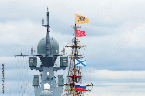 Navy day of Russia. Sailboat and warship at holiday of the Russian Navy. Mixing old and modern