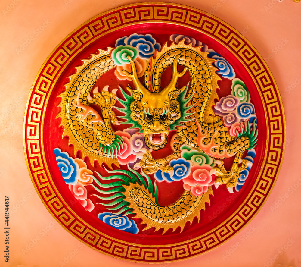Dragon art on the red wall, believed to be a mythical creature of Chinese people.