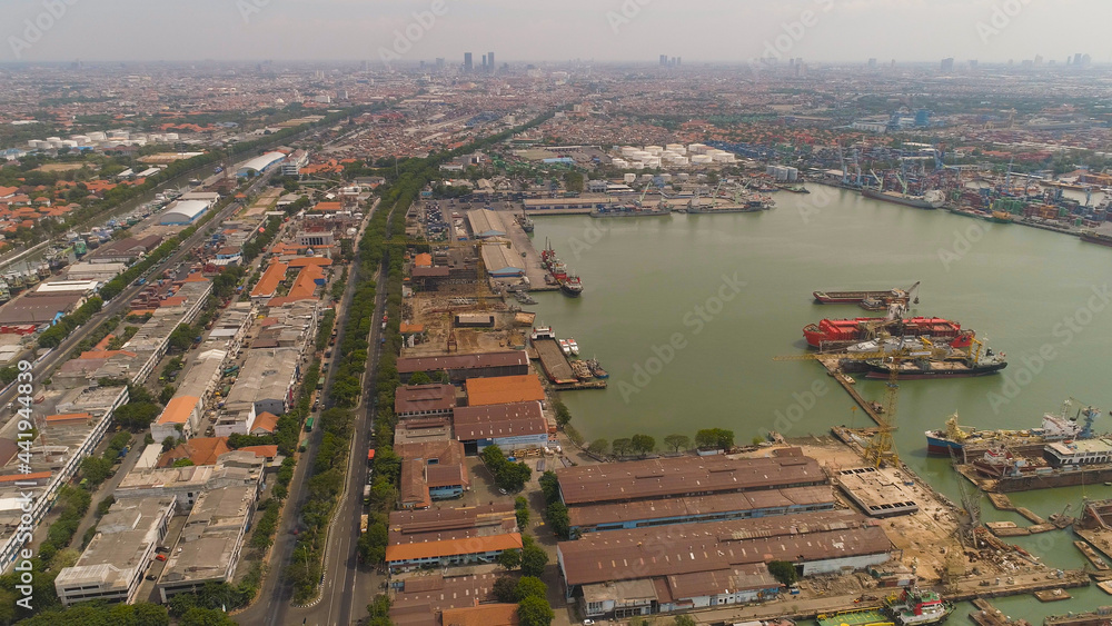 aerial view cargo and passenger seaport with ships and crane Tanjung Perak, surabaya, indonesia. docks for the repair and parking of ships, cargo port and container terminal. ship in industrial port