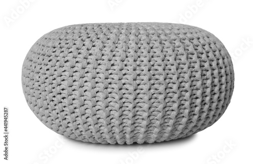 Stylish grey knitted pouf isolated on white photo