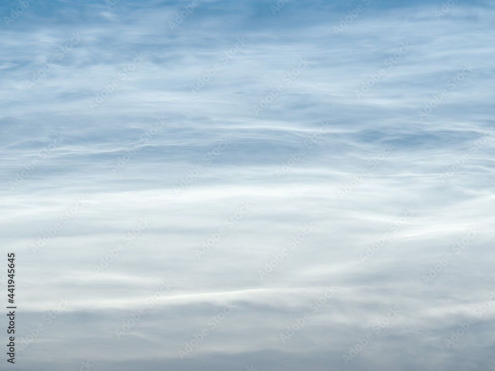 Starry sky with noctilucent clouds at summer solstice night. Fantastic cloudscape. Natural pattern, texture, background, wallpaper, graphic resources, design, abstract art, copy space. Starry sky with noctilucent clouds at summer solstice night. Fantastic cloudscape. Natural pattern, texture, background, wallpaper, graphic resources, design, abstract art, copy space.