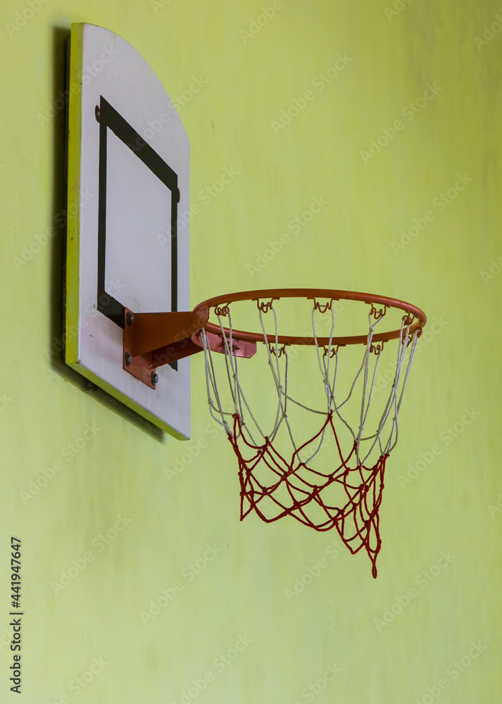basketball basket on yellow background. in the gym