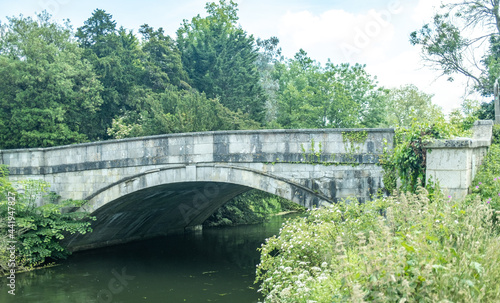 Old stone bridge over the River Test in the Hampshire town of Romsey photo