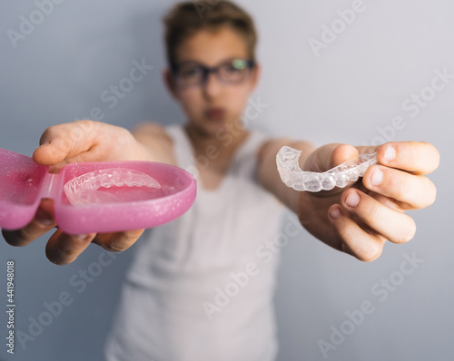 blond guy with glasses gets clear mouth braces