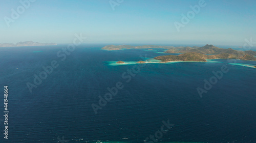 aerial drone tropical islands with blue lagoons, coral reef and sandy beach. Palawan, Philippines. Islands of the Malayan archipelago with turquoise lagoons.