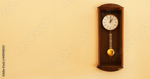 Retro clock on a wall with some copy space for additional content. © To Studio