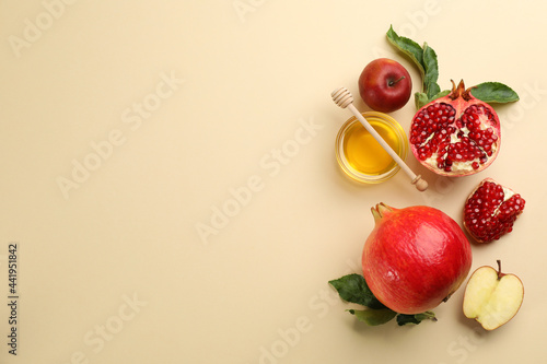 Flat lay composition with Rosh Hashanah holiday attributes on beige background. Space for text photo