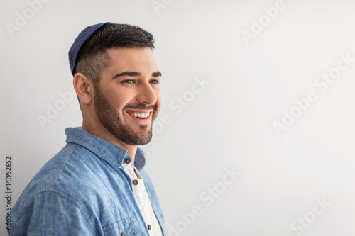 Closeup portrait of smiling jewish man in yarmulke photo
