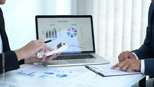 Business concept a male startup entrepreneur presenting business data in dashboard to an investor for the business expansion.