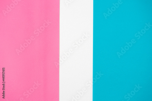 Abstract white background for design with pink and blue paper. View from above.