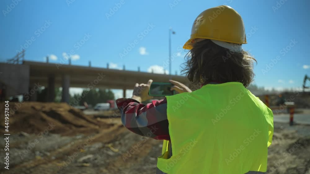 Building contractor with mobile phone shooting work they done. Building contractor with mobile phone shooting work they done.