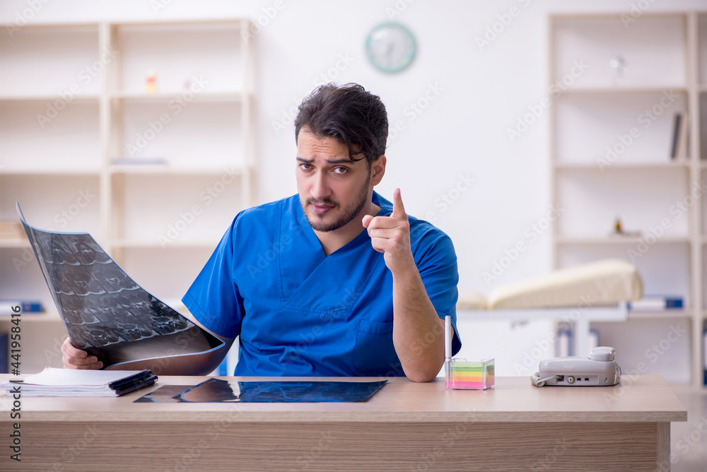 Young male doctor radiologist working in the clinic Young male doctor radiologist working in the clinic
