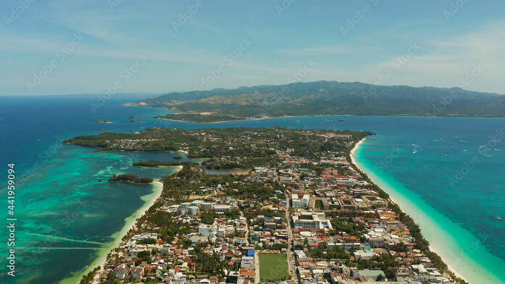 Costline of the tropical island of Boracay with sandy beaches and hotels from above. Summer and travel vacation concept. Philippines.