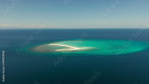 Sandy white island with beach and sandy bar in the turquoise atoll water, aerial drone. Sandbar Atoll. Tropical island and coral reef. Summer and travel vacation concept, Camiguin, Philippines.
