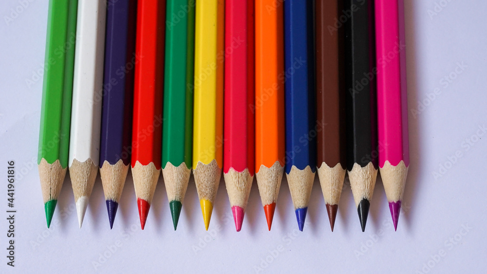 Close up of colored pencils on a white background Close up of colored pencils on a white background