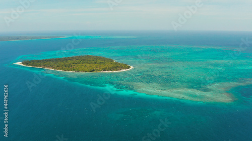 Tropical island with sandy beach by atoll with coral reef and blue sea  aerial view. Patongong Island with sandy beach. Summer and travel vacation concept.